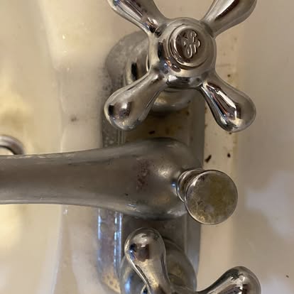 Tarnished chrome faucet before cleaning