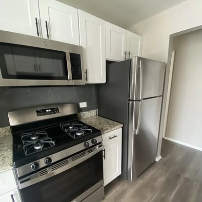 Clean stainless stove and cabinets